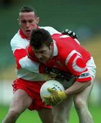 11 April 1999; Joe Kavanagh of Cork in action against Gary Coleman of Derry during the Church and General National Football League Quarter-Final match between Cork and Derry at Croke Park in Dublin. Photo by Ray McManus/Sportsfile