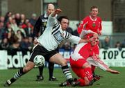 14 March 1999; Lee Thew of Dundalk in action against Pat Morley of Cork City during the Harp Lager National League Premier Division match between Cork City and Dundalk at Turners Cross in Cork. Photo by David Maher/Sportsfile