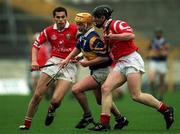 4 April 1999; Liam Cahill of Tipperary in action against Sean Og O hAilpin, left, and Wayne Sherlock of Cork during the Church & General National Hurling League Division 1B match between Tipperary and Cork at Semple Stadium in Thurles, Tipperary. Photo by Brendan Moran/Sportsfile