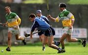 10 April 1999; Liam Walsh of Dublin in action against Billy Dooley of Offaly during the Church & General National Hurling League Division 1A match between Offaly and Dublin at St Brendan's Park in Birr, Offaly. Photo by Ray McManus/Sportsfile