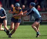 18 April 1999; Lorcan Hassett of Clare in action against John Finnegan of Dublin during the Church and General National Hurling League Division 1A match between Dublin and Clare at Parnell Park in Dublin. Photo by Damien Eagers/Sportsfile