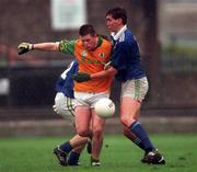 11 April 1999; Mark O'Reilly of Meath in action against Maurice Fitzgerald of Kerry during the Church & General National Football League Division 1 Quarter-Final match between Kerry and Meath at the Gaelic Grounds in Limerick. Photo by Aoife Rice/Sportsfile