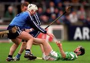 4 April 1999; Mike Galligan of Limerick in action against Michael Fitzsimons of Dublin during the Church & General National Hurling League Division 1A match between Dublin and Limerick at Parnell Park in Dublin. Photo by Ray McManus/Sportsfile