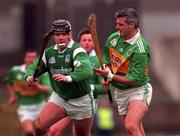 11 April 1999; Mike O'Brien of Limerick in action against Seamus McIntyre of Kerry during the Church & General National Hurling League Division 1A match between Limerick and Kerry at the Gaelic Grounds in Limerick. Photo by Aoife Rice/Sportsfile