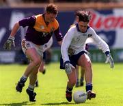 18 April 1999; Declan Newell of St Jarlath's in action against Niall Murphy of Good Counsel during GAA All-Ireland Post Primary Senior A Schools Football Hogan Cup Final match between St Jarlath's Tuam, Galway and Good Counsel New Ross, Wexford at Croke Park in Dublin. Photo by Matt Browne/Sportsfile