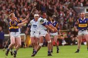 18 April 1999; Peter Queally of Waterford in action against Aidan Ryan of Tipperary during the Church and General National Hurling League Division 1B match between Tipperary and Waterford at Semple Stadium in Thurles, Tipperary. Photo by Aoife Rice/Sportsfile