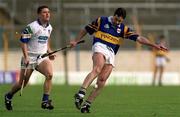 18 April 1999; Raymie Ryan of Tipperary in action against Ken McGrath of Waterford during the Church and General National Hurling League Division 1B match between Tipperary and Waterford at Semple Stadium in Thurles, Tipperary. Photo by Brendan Moran/Sportsfile