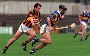28 March 1999; Thomas Dunne of Tipperary in action against Brian McEvoy of Kilkenny during the Church and General National Hurling League Division 1B match between Kilkenny and Tipperary at Nowlan Park in Kilkenny. Photo by Matt Browne/Sportsfile