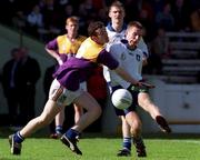 18 April 1999; Tomas Griffin of St Jarlath's in action against John Finn of Good Counsel during GAA All-Ireland Post Primary Senior A Schools Football Hogan Cup Final match between St Jarlath's Tuam, Galway and Good Counsel New Ross, Wexford at Croke Park in Dublin. Photo by Matt Browne/Sportsfile