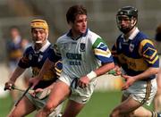 18 April 1999; Tony Browne of Waterford in action against Liam Cahill, left, and Thomas Dunne of Tipperary during the Church and General National Hurling League Division 1B match between Tipperary and Waterford at Semple Stadium in Thurles, Tipperary. Photo by Brendan Moran/Sportsfile