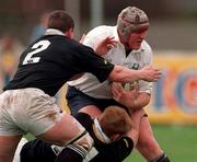 3 April 1999; Ultan O'Callaghan of Cork Constitution is tackled by Shane Stewart and Adrian Stewart, left, of Ballymena of Ballymena during the AIB All-Ireland League Division 1 match between Cork Constitution RFC and Ballymena RFC at Temple Hill in Cork. Photo by Brendan Moran/Sportsfile