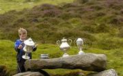 30 July 2005; A child examines the trophies before the M Donnelly Poc Fada na hEireann Final. Annaverna Mountain Ravensdale, Cooley Mountains, Co. Louth. Picture credit; Damien Eagers / SPORTSFILE