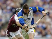 31 July 2005; Brendan Cummins, Tipperary goalkeeper is tackled by Niall Healy, Galway. Guinness All-Ireland Hurling Championship, Quarter-Final, Galway v Tipperary, Croke Park, Dublin. Picture credit; Damien Eagers / SPORTSFILE