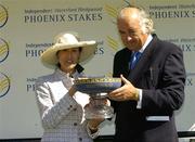 7 August 2005; Lady Chryss O'Reilly, wife of Sir Anthony O'Reilly presents the Independent Waterford Wedgwood Phoenix Stakes trophy to the owner of George Washington, Mr. John Magnier. Curragh Racecourse, Co. Kildare. Picture credit; Matt Browne / SPORTSFILE