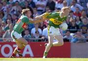 7 August 2005; Colm Cooper, Kerry, holds off the challenge of Dermot Geraghty, Mayo. Bank of Ireland Senior Football Championship Quarter-Final, Kerry v Mayo, Croke Park, Dublin. Picture credit; Brendan Moran / SPORTSFILE
