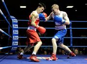 28 February 2014: Paddy Barnes, right, Holy Family Boxing Club, exchanges punches with Blaine Dobbins, St Josephs Boxing Club, during their 49kg bout. IABA Elite National Championship Semi-Finals, National Stadium, Dublin. Picture credit: Ray Lohan / SPORTSFILE