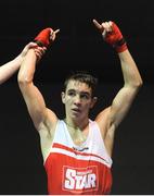 28 February 2014; Michael Conlan, St John Bosco Boxing Club, celebrates as he is declared the winner over Barry Walsh, St Colmans Boxing Club, following their 56 kg bout. 2014 National Elite Boxing Championship Finals, National Stadium, Dublin. Picture credit: Ray Lohan / SPORTSFILE