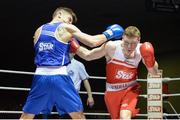 28 February 2014; Ray Moylette, St Annes Boxing Club, right, exchanges punches with Michael Nevin, Portlaoise Boxing Club, during their 64 kg bout. 2014 National Elite Boxing Championship Finals, National Stadium, Dublin. Picture credit: Ray Lohan / SPORTSFILE