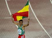 8 August 2005; Ethiopia's Kenenisa Bekele celebrates with the Ethiopian flag after victory in the Men's 10,000m final. 2005 IAAF World Athletic Championships, Helsinki, Finland. Picture credit; Pat Murphy / SPORTSFILE