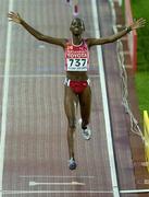 8 August 2005; Docus Inzikuru, Uganda, celebrates as she  crosses the line to win the Women's 3000m steeplechase Final. 2005 IAAF World Athletic Championships, Helsinki, Finland. Picture credit; Pat Murphy / SPORTSFILE