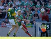 7 August 2005; Ciaran McDonald, Mayo, kicks a point with the outside of his left foot watched by Michael McCarthy, Kerry. Bank of Ireland Senior Football Championship Quarter-Final, Kerry v Mayo, Croke Park, Dublin. Picture credit; Brendan Moran / SPORTSFILE
