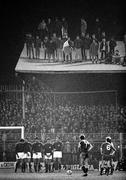 5 February 1985; Fans stand on the roof of one of the terraces as the Republic of Ireland line up a free kick. Friendly International, Republic of Ireland v Italy, Dalymount Park, Dublin. Picture credit; Ray McManus / SPORTSFILE