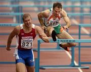 10 August 2005; Peter Coghlan, Ireland, who finished in 7th place, clears the final hurdle behind Russia's Igor Peremota in his Men's 110m Hurdles heat. 2005 IAAF World Athletic Championships, Helsinki, Finland. Picture credit; Pat Murphy / SPORTSFILE