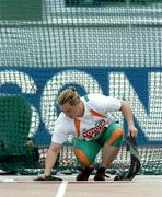 10 August 2005; Eileen O'Keeffe, Ireland, wets the circle in the hammer throw cage with a cloth before her second throw during the Women's Hammer Throw qualification competition. 2005 IAAF World Athletic Championships, Helsinki, Finland. Picture credit; Pat Murphy / SPORTSFILE
