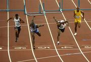 12 August 2005; Ladji Doucoure, France, second from left, gets accross the line ahead of second placed Allen Johnson, USA, second from right, Terrance Tramell, USA, left, and Maurice Wignall, Jamaica, right, for victory in the Men's 110m Hurdles Final. 2005 IAAF World Athletic Championships, Helsinki, Finland. Picture credit; Pat Murphy / SPORTSFILE