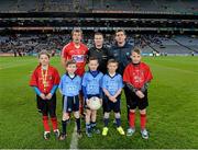 1 March 2014; Matchday mascots and young whistlers Caoimhe Keohane, Scoil Ui Chonaill GAA Club, Darragh Brady, St Marks GAA Club, Tallaght, Ryan Coyne, Trinity Gaels GAA Club, and Christopher Mulligan, also Trinity Gaels GAA Club, with match referee Padraig Hughes and the two captains, James Loughrey, Cork, and Stephen Cluxton, Dublin, before the game. Allianz Football League, Division 1, Round 3, Dublin v Cork, Croke Park, Dublin. Picture credit: Ray McManus / SPORTSFILE