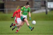 2 March 2014; Louise Galvin, Kerry, solos clear of Anne Marie Walsh, Cork. Tesco Homegrown Ladies National Football League, Division 1, Round 4, Kerry v Cork, Pairc an Aghasaigh, Dingle, Co.Kerry. Picture credit: Brendan Moran / SPORTSFILE