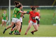 2 March 2014; Ciara O'Sullivan, Cork, in action against Deirdre Corridan and Louise Galvin, Kerry. Tesco Homegrown Ladies National Football League, Division 1, Round 4, Kerry v Cork, Pairc an Aghasaigh, Dingle, Co.Kerry. Picture credit: Brendan Moran / SPORTSFILE