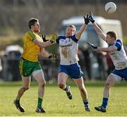2 March 2014; Christy Toye, Donegal, in action against Kieran Hughes and Colin Walshe, Monaghan. Allianz Football League, Division 2, Round 3, Donegal v Monaghan, O'Donnell Park, Letterkenny, Co. Donegal. Picture credit: Oliver McVeigh / SPORTSFILE