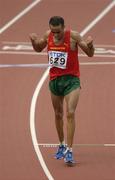 13 August 2005; Jaouad Gharib, Morocco, celebrates after crossing the finish line for victory in the Men's Marathon. 2005 IAAF World Athletic Championships, Helsinki, Finland. Picture credit; Pat Murphy / SPORTSFILE