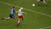 13 August 2005; Owen Mulligan, Tyrone, shoots past Barry Cahill, 6, and Stephen Cluxton, Dublin, to score his side's goal. Bank of Ireland All-Ireland Senior Football Championship Quarter-Final, Dublin v Tyrone, Croke Park, Dublin. Picture credit: Ray McManus / SPORTSFILE