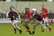 13 August 2005; Peter O'Driscoll, Cork, in action against Ciaran O'Donovan, right, and Francis Kerrigan, Galway. All-Ireland Minor Hurling Championship Semi-Final, Cork v Galway, O'Moore Park, Portlaoise, Co. Laois. Picture credit; Matt Browne / SPORTSFILE