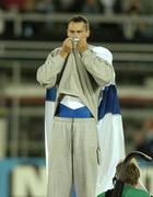 13 August 2005; Tommi Evila, Finland, kisses the flag on his jumper after winning a bronze medal in the men's long jump final. 2005 IAAF World Athletic Championships, Helsinki, Finland. Picture credit; Pat Murphy / SPORTSFILE
