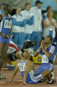13 August 2005; Three of the four members of the French Relay team await the final result of the Men's 4x100m relay Final. 2005 IAAF World Athletic Championships, Helsinki, Finland. Picture credit; Pat Murphy / SPORTSFILE