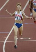 14 August 2005; Tatyana Tomashova, Russia, crosses the finish line to win the Women's 1500m Final. 2005 IAAF World Athletic Championships, Helsinki, Finland. Picture credit; Pat Murphy / SPORTSFILE