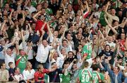 15 August 2005; Neal Horgan, no.22, Cork City, celebrates after scoring his sides first goal with supporters and team-mates Liam Kearney and Joe Gamble. eircom League, Premier Division, Cork City v Shelbourne, Turners Cross, Cork. Picture credit; David Maher / SPORTSFILE