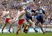 13 August 2005; Brian McGuigan, Tyrone, in action against Coman Goggins and Paul Casey, right, Dublin. Bank of Ireland All-Ireland Senior Football Championship Quarter-Final, Dublin v Tyrone, Croke Park, Dublin. Picture credit; Damien Eagers / SPORTSFILE
