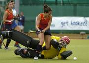 17 August 2005; Lucia Antona, Spain, goes round French goalkeeper Marion Rehby, on her way to scoring her sides 5th goal. 7th Women's European Nations Hockey Championship, Pool B, Spain v France, Belfield, UCD, Dublin. Picture credit; Brendan Moran / SPORTSFILE