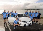 3 March 2014; At the announcement of Toyota Ireland becoming the official car partner to Dublin GAA are, from left Dublin footballers Rory O'Carroll and Darren Daly, Dublin hurler Michael Carton, Dublin footballers Jonny Cooper and Cian O'Sullivan, Dublin hurlers Johnny McCaffrey, Liam Rushe, Dublin footballer James McCarthy, Eoghan O'Gara, Dublin hurler Conal Keaney and Peter Kelly, and Dublin footballer Stephen Cluxton. As part of the three year deal Toyota will provide a total of 16 vehicles which will see players and management of the Dublin senior football and hurling teams enjoy the comfort, quality and reliability that Toyota vehicles are renowned for. Bull Island, Dublin. Photo by Sportsfile
