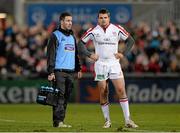 28 February 2014; Jared Payne, Ulster, along with injured player and watercarrier Paddy Wallace. Celtic League 2013/14, Round 16, Ulster v Newport Gwent Dragons. Ravenhill Park, Belfast, Co. Antrim. Picture credit: Oliver McVeigh / SPORTSFILE