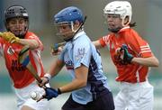 14 August 2005; Ciara Lucey, Dublin, in action against Emer Carragher, left, and Marie Larkin, Armagh. All-Ireland Junior Camogie Championship Semi-Final, Dublin v Armagh, Parnell Park, Dublin. Picture credit; David Maher / SPORTSFILE