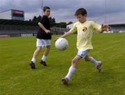 16 August 2005; Dylan McGuinness, aged 9, from East Wall, practices his kicking during the Docklands Festival of Gaelic Football and Hurling. The Festival was developed to help young people from the Docklands further develop their hurling and football skills and become more confident and accomplished players. Parnell Park, Dublin. Picture credit; Brian Lawless / SPORTSFILE