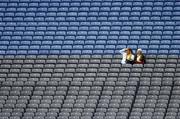 14 August 2005; Two Clare fans watch the match as they wait for the start of Clare v Cork semi-final. Christy Ring Cup Final, Down v Westmeath, Croke Park, Dublin. Picture credit; Brian Lawless / SPORTSFILE