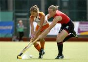 19 August 2005; Sylvia Karres, Netherlands, in action against Mel Clewlow, England. 7th Women's European Nations Hockey Championship, Semi-Final, England v Netherlands, Belfield, UCD, Dublin. Picture credit; Brendan Moran / SPORTSFILE