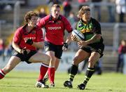 19 August 2005; Carlos Spencer, Northampton, in action against John O'Sullivan and Stephen Keogh, Munster. Munster Pre-Season Friendly 2005-2006, Munster v Northampton Saints, Thomond Park, Limerick. Picture credit; Kieran Clancy / SPORTSFILE