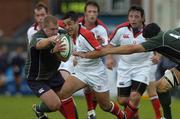 19 August 2005; Kieran Campbell, Ulster, is tackled by Richard Skuse, left and Kieran Roche, London Irish. Ulster Pre-Season Friendly 2005-2006, Ulster v London Irish, Ravenhill, Belfast. Picture credit; Matt Browne / SPORTSFILE